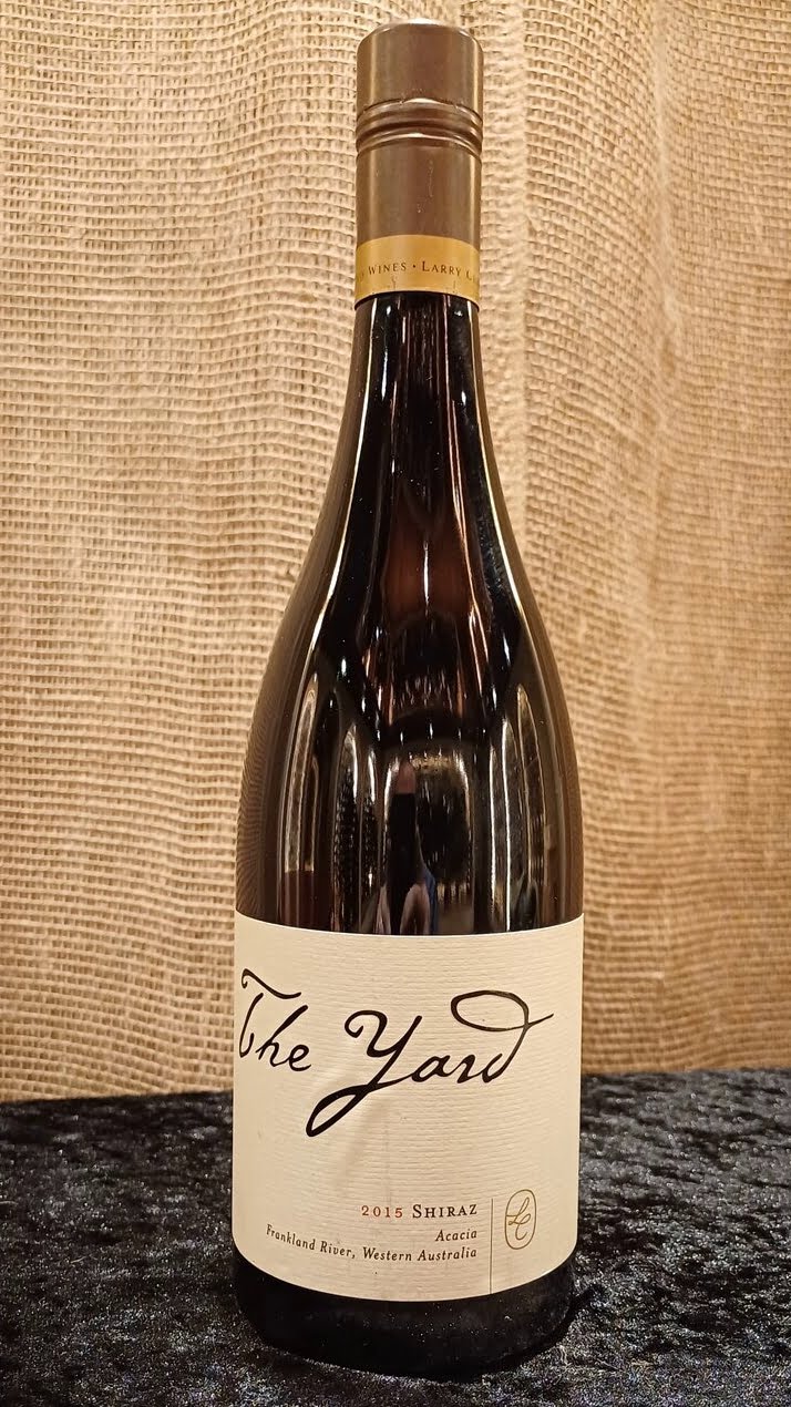 The Larry Cherubino The Yard Shiraz 2015 from the Acacia Vineyard is a wine that truly showcases the elegance and depth of Shiraz from Western Australia. In the glass, it presents a deep, vibrant ruby color.