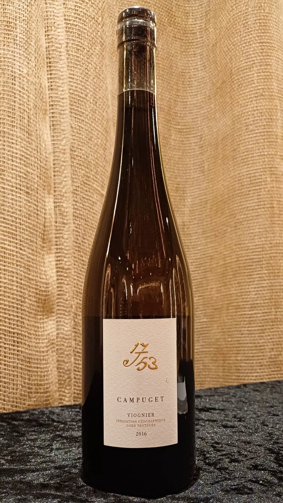 The Campuget IGP Gard Viognier 1753 2016 is an elegant and expressive wine. It opens with a bouquet of honeysuckle, apricot, orange marmalade, and tropical fruits.