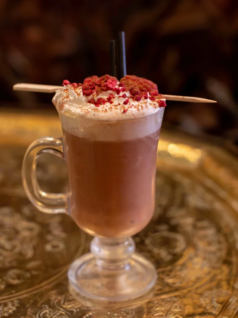 Indulge in the luxurious warmth of the Hot Raspberry Truffle Cocktail, a decadent blend that promises to delight your senses. This exquisite drink features the rich flavours of Pimm's Sundowner and Rosemullion Chocolate Rum, perfectly balanced with creamy milk hot chocolate.