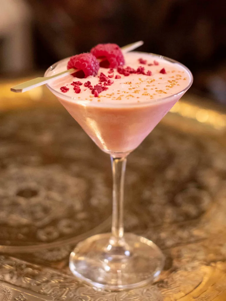 The Pink Velvet cocktail is a delightful blend of elegance and indulgence. This luscious drink combines the smooth richness of tequila with the sweet, raspberry notes of Chambord.