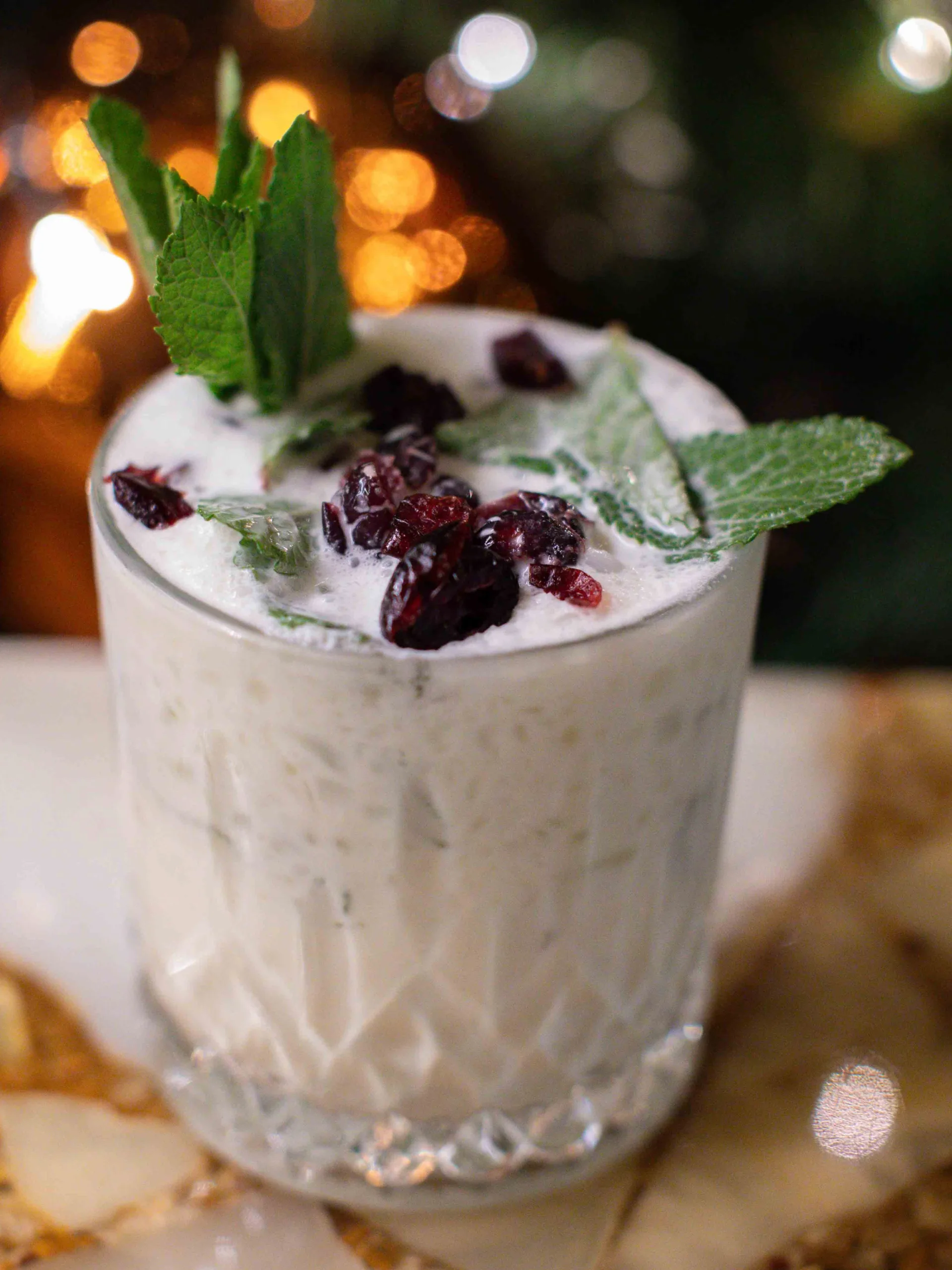 This luscious Coconut Mojito cocktail offers a velvet-smooth texture of sweet coconut cream and Malibu, brightened by zesty lime and cooling mint, with a chewy, tart finish from the dried cranberries.