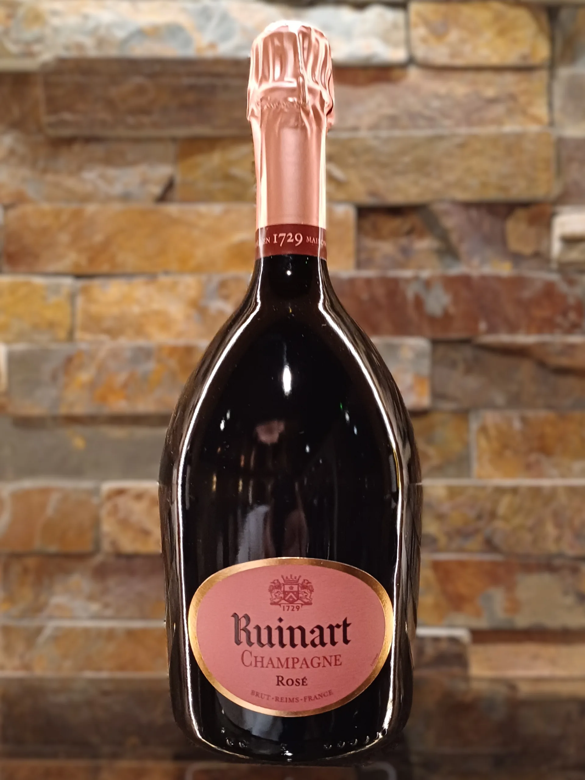 Ruinart Rose Champagne is a blend of 45% Chardonnay and 55% Pinot Noir, sourced from the finest vineyards in the Champagne region