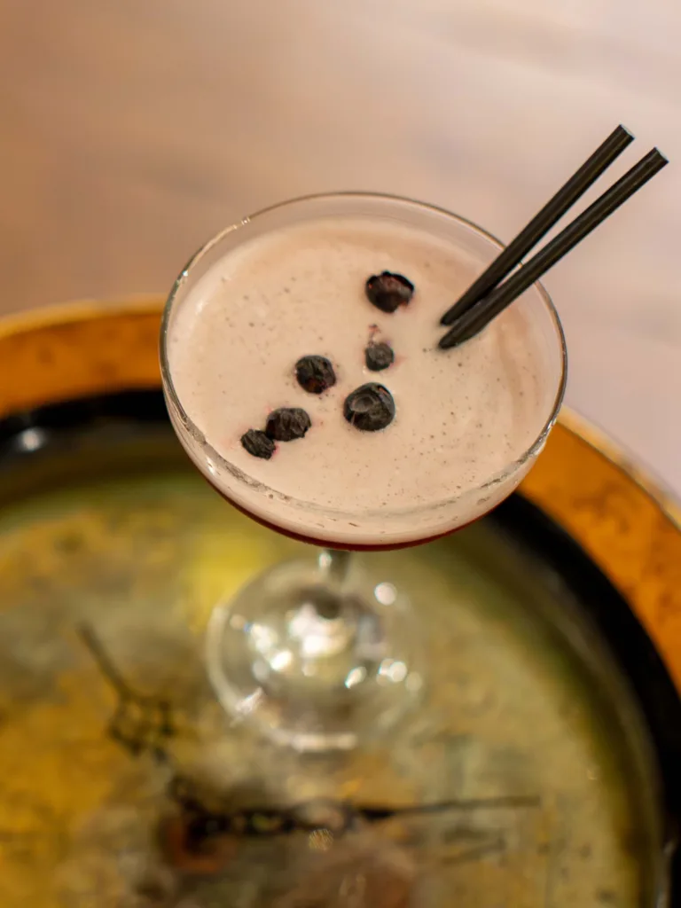 The first sip of the Midnight Marg cocktail is a vibrant awakening, a thrilling tension between bold and bright. Leading the charge is the unmistakable, agave-laced warmth of Patrón Tequila