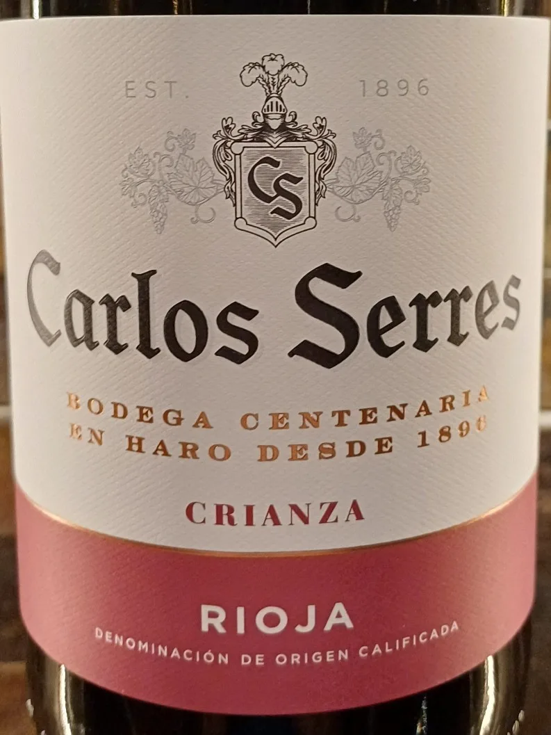 Carlos Serres Rioja Crianza offers a smooth and classic taste of ripe red cherry and raspberry, elegantly layered with notes of sweet vanilla spice from its oak aging.