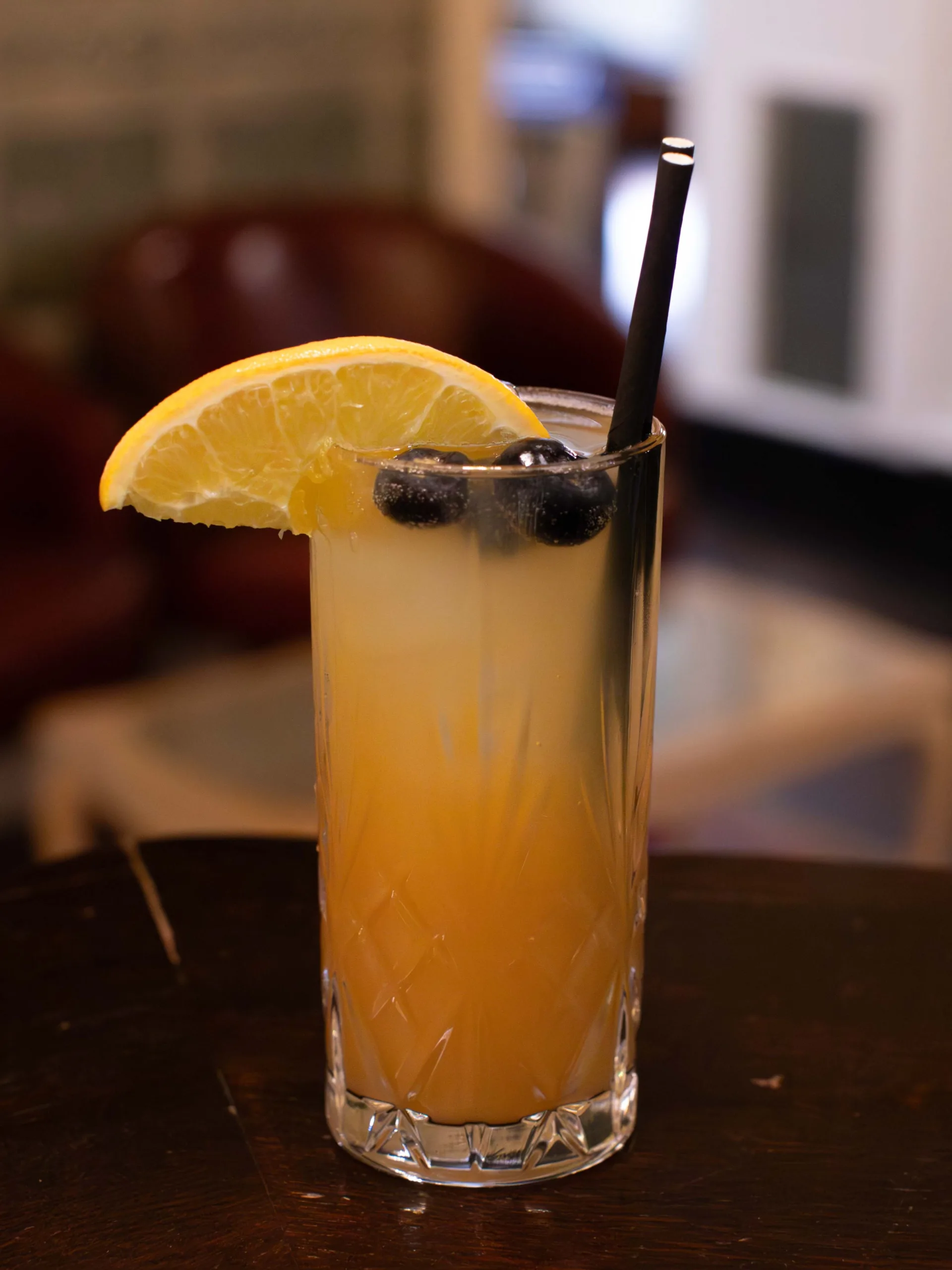 The Grapefruit Coastal Fizz Mocktail is a crisp and complex alcohol-free cooler that artfully balances the tart bitterness of grapefruit with tropical pineapple and lime for a refreshing experience