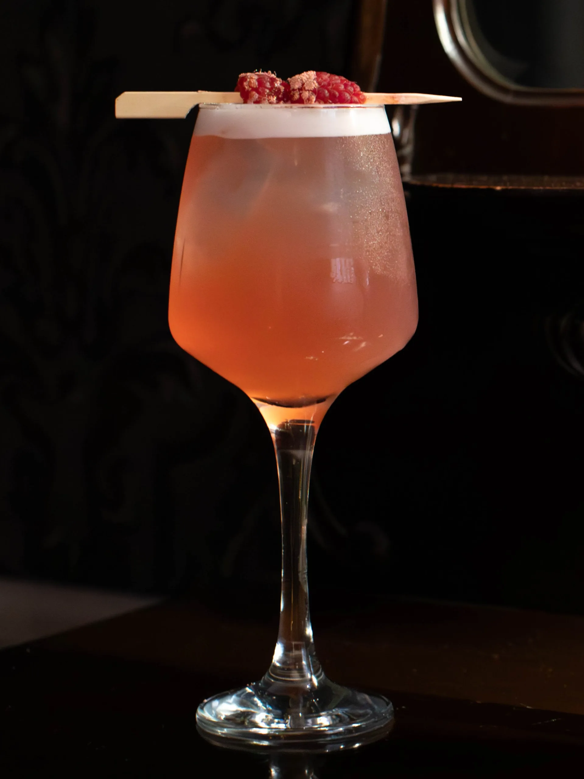 The Beauty Cocktail is a sophisticated, effervescent fusion of crisp rosé and smooth vodka, perfectly balancing a sharp red-berry tartness with a luxurious, silky finish.