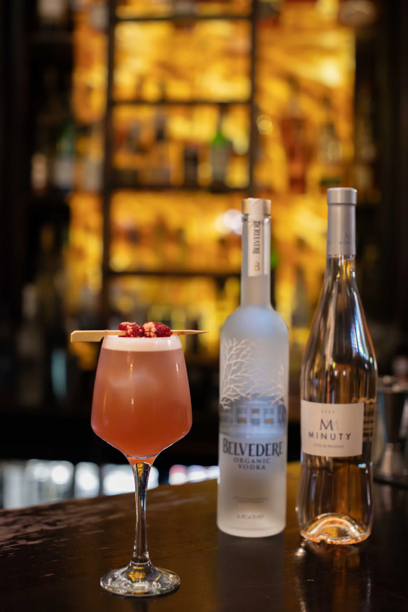 The Beauty Cocktail is a sophisticated, effervescent fusion of crisp rosé and smooth vodka, perfectly balancing a sharp red-berry tartness with a luxurious, silky finish.