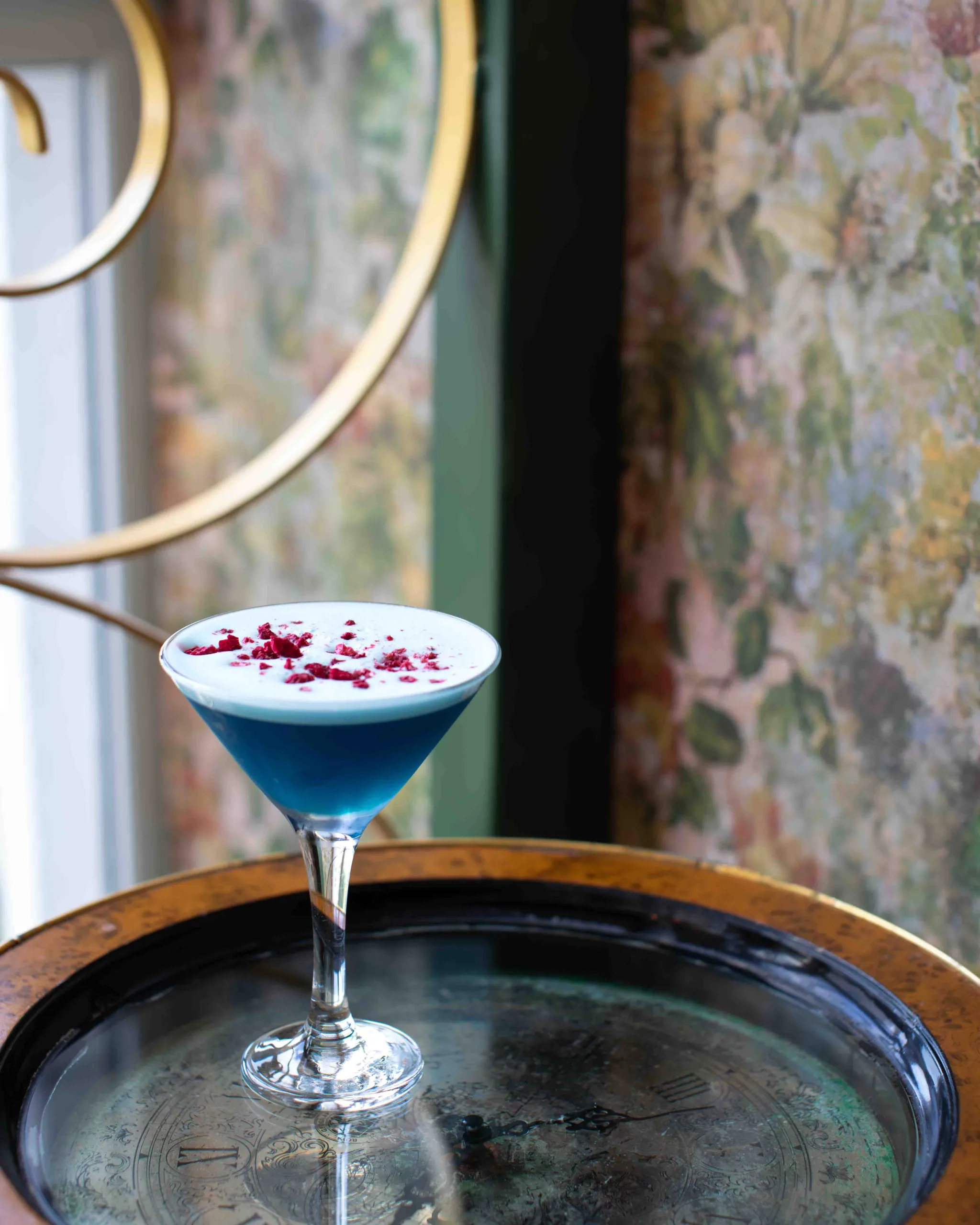 Beneath a velvety foam, the Blue Vine Cocktail delivers a vibrant wave of sweet candied grape and bittersweet orange, perfectly balanced by crisp apple and a sharp, refreshing lemon finish.