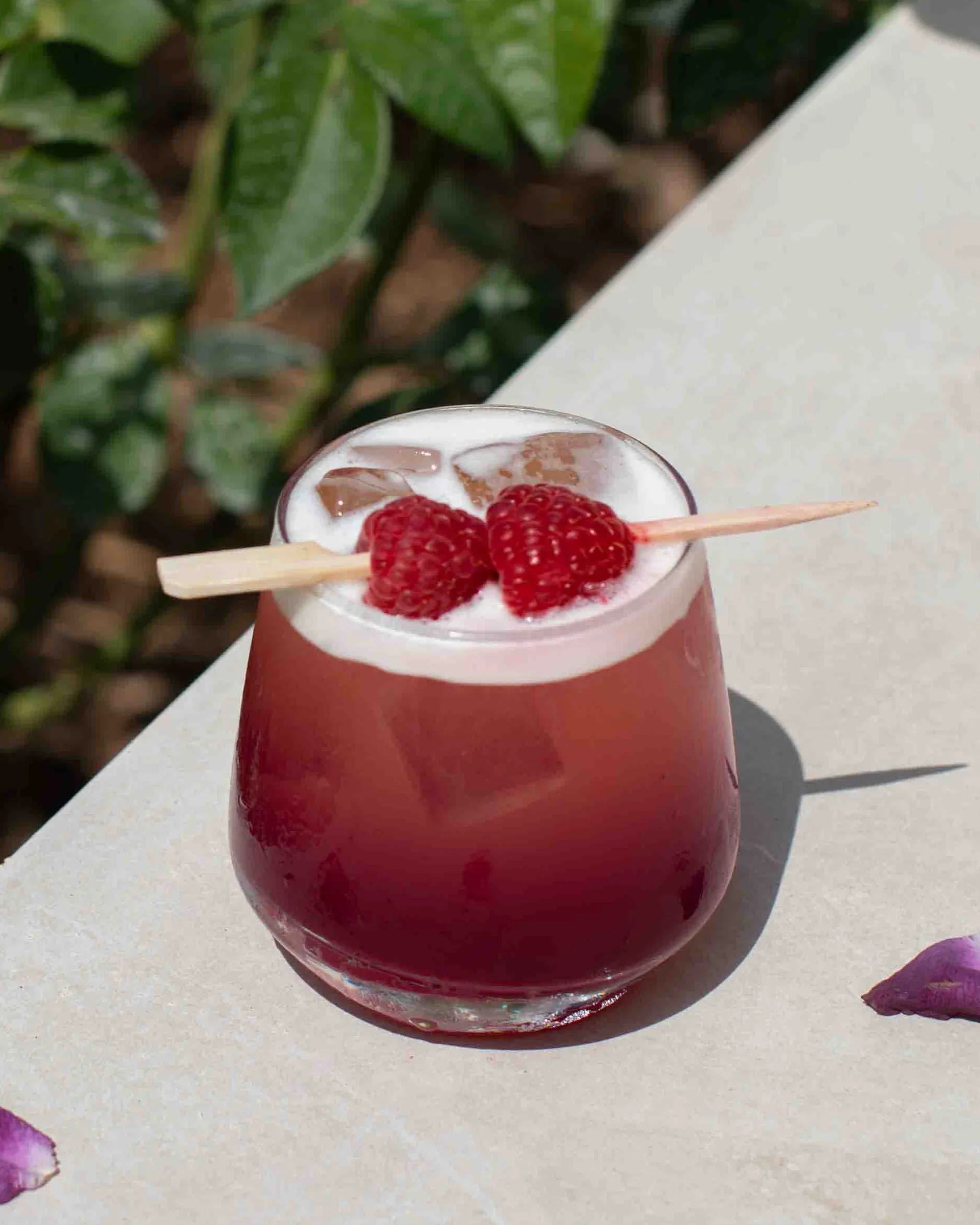The Lavender Haze Cocktail is a dreamy, purple-hued blend built on a base of pineapple juice, its tropical sweetness balanced by sharp hits of fresh lemon and lime