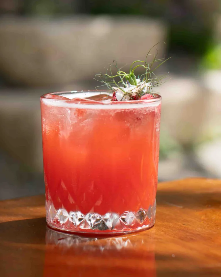 Dolce Passione 'Sweet Passion' is a tropical, tangy passionfruit vodka cocktail rounded out by Pimm's fruity warmth and pineapple juice, lightened with a fizzy lemonade top