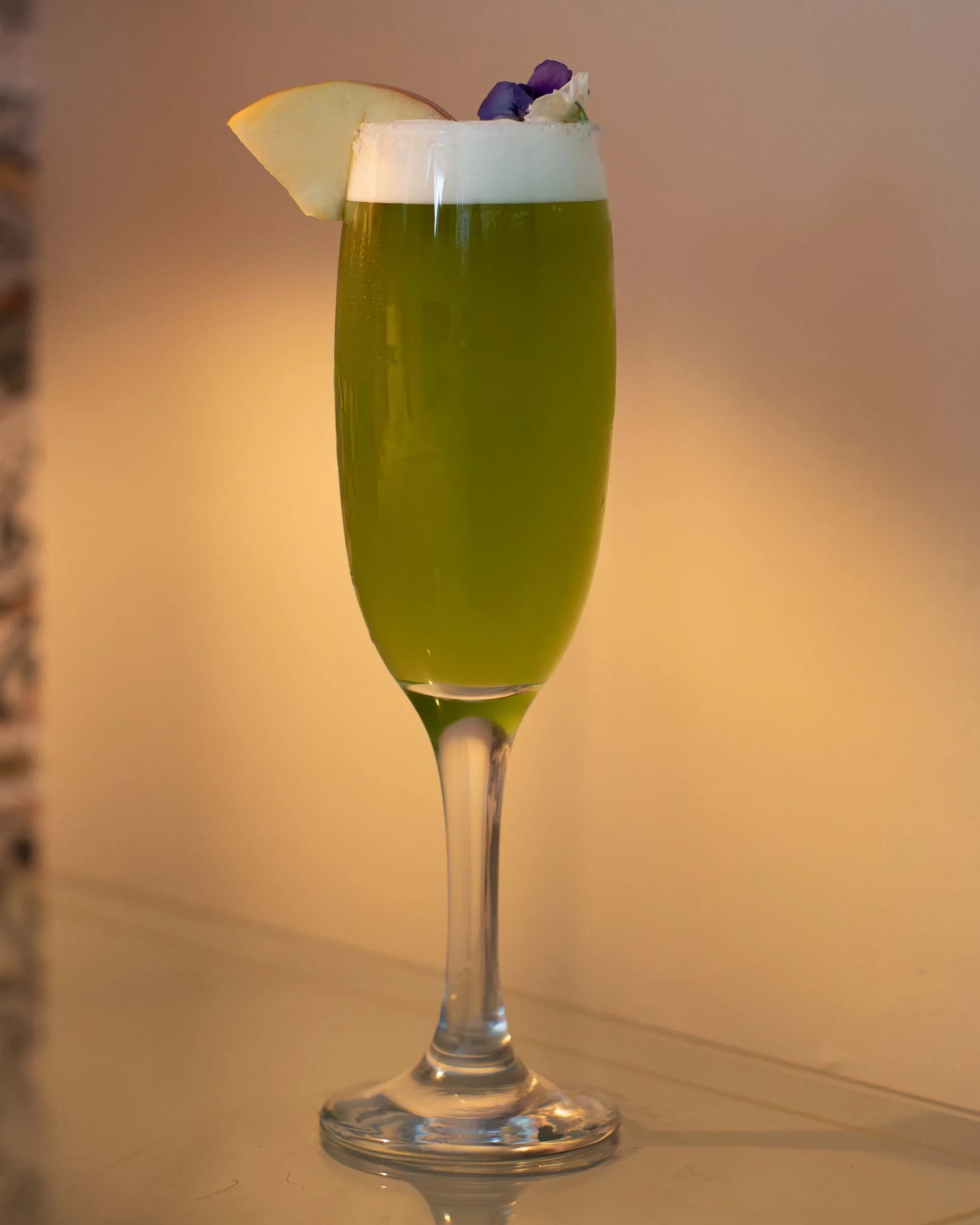 Candy Apple Cocktail - A spiced rum cocktail built around toffee-apple sweetness: warming cinnamon and clove, rich apple syrup and juice, a lift of ripe mango, and tangy pineapple, finishing bright, fruity and moreish.