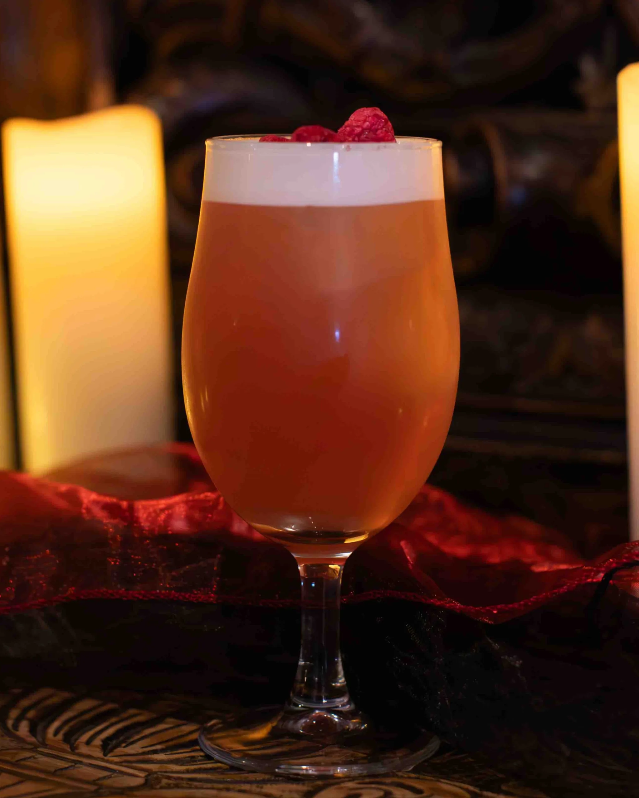 Twin Flame cocktail - A fruity vodka cocktail pairing raspberry vodka with floral lychee, tart cranberry and fresh lime, topped with silky foam: vivid pink, juicy and refreshing, with a bright, lightly perfumed finish.